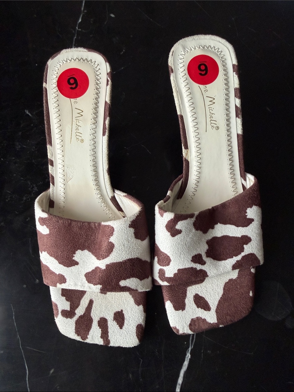 Anne Michelle Brown and White Cow-Print Slide Mules